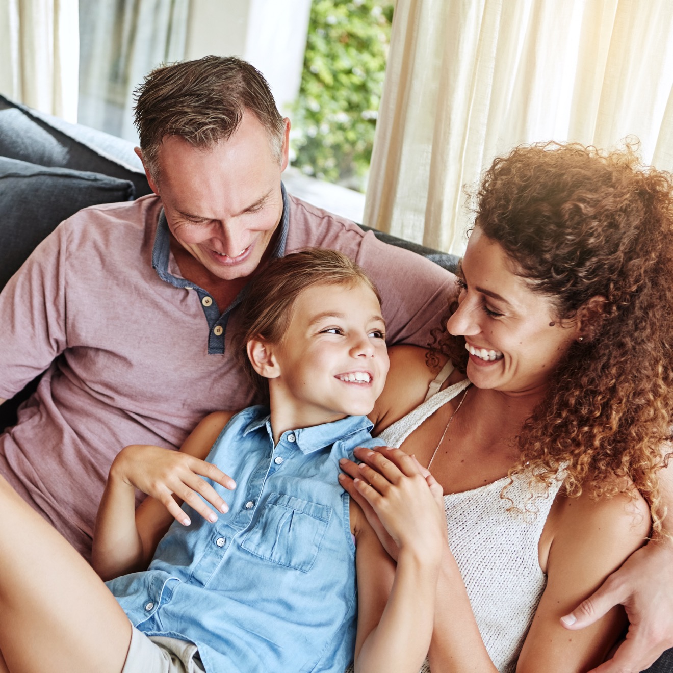 Happy family relaxing together in their new home